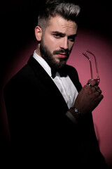 young businessman taking off his sunglasses