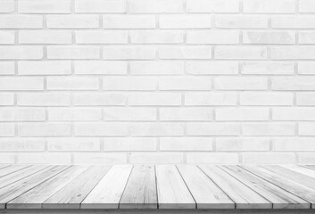 Empty wooden table top on white brick wall background, Design wood terrace white. Perspective for show space for your copy and branding. Can be used as product display montage. Vintage style concept.