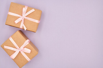 Christmas or New Year gift boxes on a purple background with copy space