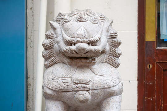 A guardian lion statue in London Chinatown