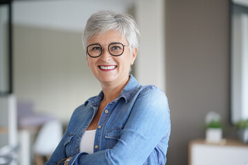 portrait of a beautiful smiling 50-year-old woman with white hair - Powered by Adobe