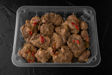 Baked beef or pork goulash in a sauce with onions and bell peppers, ready to eat, vacuum packed....