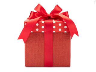 Red polka dots gift box with bow isolated on white