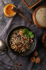 Healthy breakfast, seed and nut mix with honey and mint