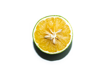 Half of lime citrus fruit. Lime cut isolated on white background. Sliced lime half with clipping path