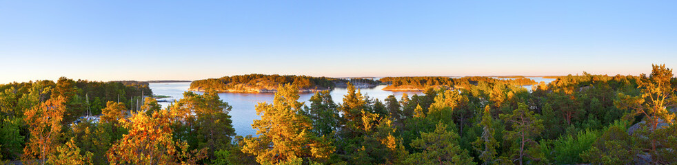 Fototapeta premium Panoramic photo of Swedish nature archipelago during late summer, evening sunset.