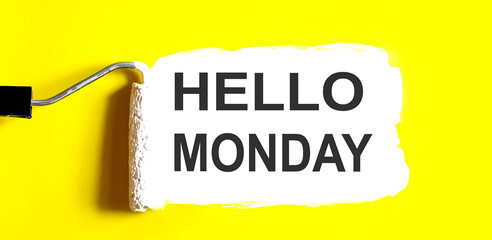 Hello Monday.One open can of paint with white brush on it on yellow background. Top view. Repairing concept. © Iryna