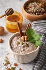 Healthy breakfast, seed and nut mix with honey and mint