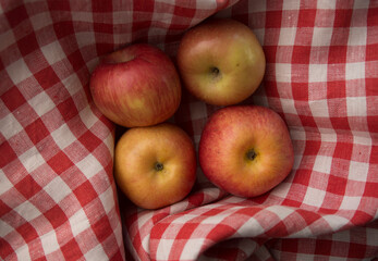apples on a checkered fabric