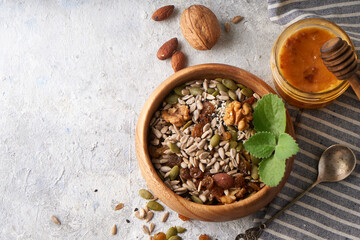 Healthy breakfast, seed and nut mix with honey and mint