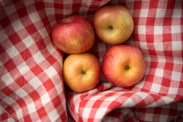 apples on a checkered fabric