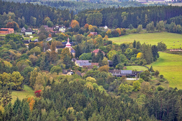 Picturesque autumn landscape with colored trees in western Bohemia.