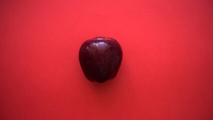apple on a red background