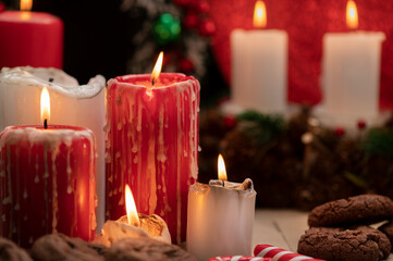 Obraz na płótnie Canvas Romantic festive still life. Advent decoration with burning candle. Christmas background. 