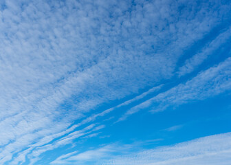 Blue sky with wispy white clouds