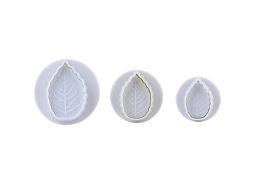 Plastic cutter for mastic shaped as leaf isolated on white background. Mold, bakeware. Top view,...