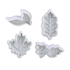 Plastic cutter for mastic shaped as leaf isolated on white background. Mold, bakeware. Top view, flat lay