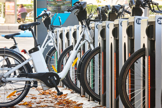 Urban electric bikes charging batteries in the city. Transportation