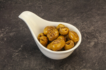 Green grilled olives in the bowl