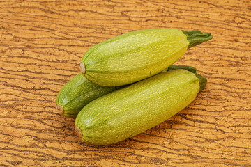 Young tasty zucchini over board