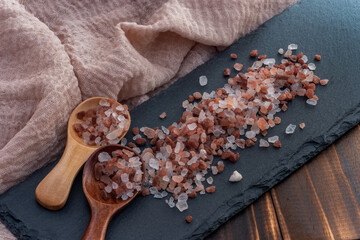 Shooting pink rock salt on stone tray
