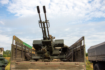 Double-barreled anti-aircraft gun in the back of the car