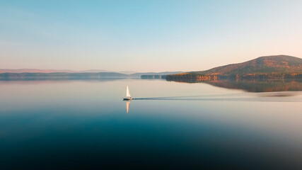 Yacht in blue lake in the evening with amazing background- beautiful  blue sky