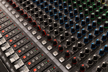 Buttons and knobs to adjust a mixer for music and sound processing