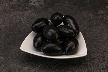 Pickled black olives in the bowl