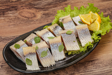 Herring fillet with sliced lemon