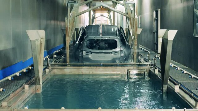 Car body electrophoretic coating process at a car manufacturing facility