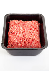 A black plastic tray of ground beef isolated on white background.
