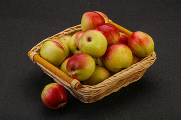 Sweet small nectarines in the basket