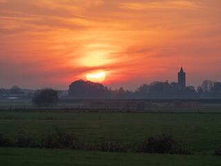 Church of Westbroek in Holland during foggy sunset