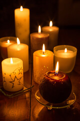Candles on wooden background. Candlelights for Christmas.