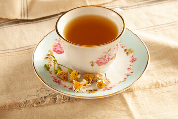 dried daisies and chamomile tea