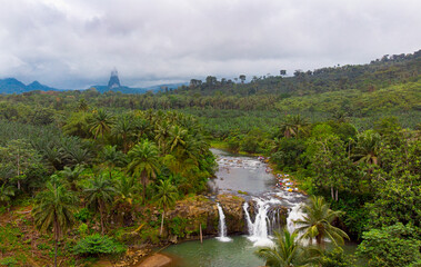 Cao Grande Peak in Sao Tome and Principe and waterfall 