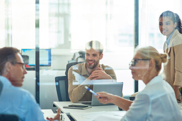 Obraz premium Group of multiracial business people sitting in board room in the modern office and discussing something while having a meeting