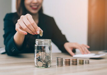 women putting coin in piggy bank. saving money, budget, investment, finance concept