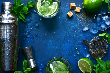 Ingredients and props for making cold summer cocktail mojito. Top view with copy space.