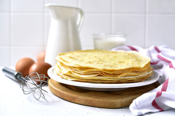 Stack of hot thin pancakes.