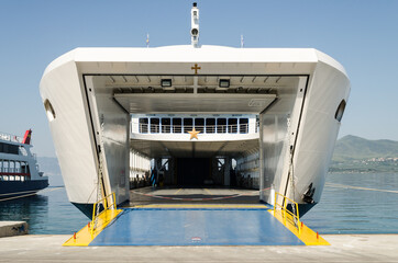 Evia island, Greece - June 30. 2020: Anchored ferry in the port of Edipsos - Greece