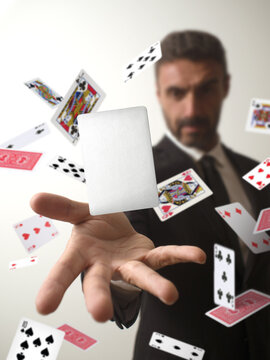 Magician making a card appear from a deck of cards