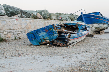 Abandoned wooden boats on the streets of the island of Evia, Greece 