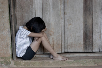 young homeless Asian child who is at high risk of being bullied, trafficked and abused, traumatized children concept.