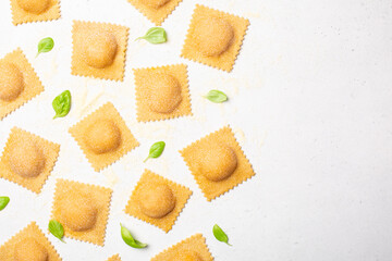 Home made ravioli on the white table.