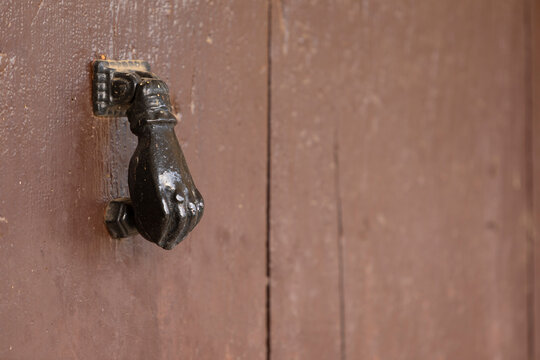 Picaporte en forma de mano