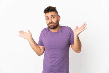 Caucasian man isolated on white background having doubts while raising hands