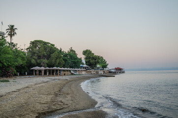 Fototapeta premium Evia island, Greece - June 28. 2020: Sandy beach in the morning on the island of Evia, Greece 