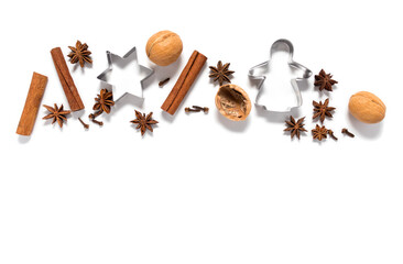 Fragrant spices, nuts and cookie shapes isolate on a white background with a place for text